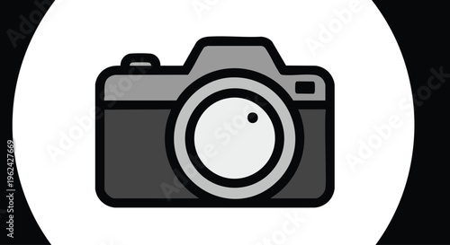 A grayscale, stylized depiction of a photographic device with a central lens and surrounding design. It is framed within a white circle against a black backdrop