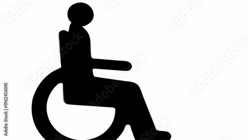 Black silhouette of a person in a wheelchair symbolizing accessibility and disability awareness on a white background