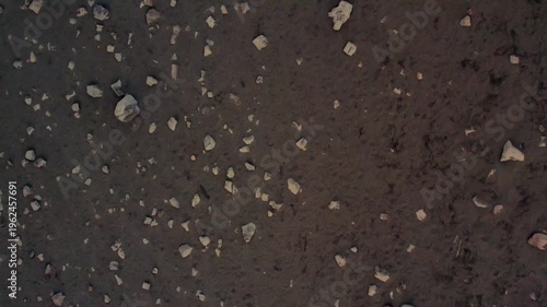 drone shot of a bridge between continents in Iceland black soil