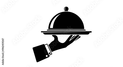 Silhouette of a hand holding a covered serving dish