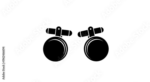 Black and white illustration of cufflinks.