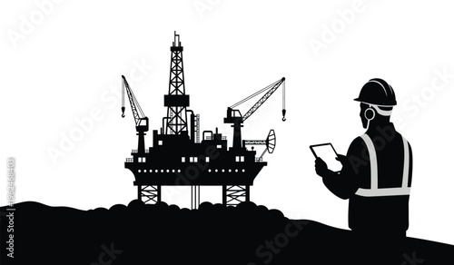 Silhouette of an oil rig worker standing near an offshore drilling platform in silhouette