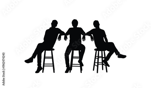 Three friends sitting in silhouette on stools socializing