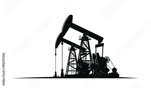 Silhouette of an oil pump jack in operation at a drilling site