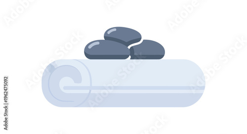 Rolled yoga mat with stones in minimalist gray tones for wellness