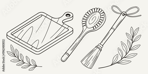 A collection of vintage kitchen utensils including a grater, a whisk, and a pastry brush.