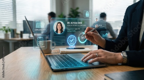 A woman using a futuristic holographic interface on a laptop