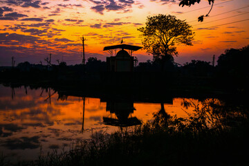 Plexiglas schilderij Reflectie Indiase tempel silhouet bij zonsopkomst  © DavidOsborne