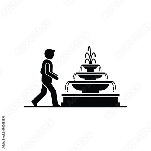 Man walking past a tiered water fountain in a park.