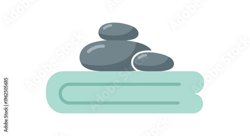 Canvas Print Stacked gray stones on rolled mint green towel in minimalist zen spa setting for