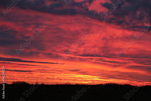 Sunrise outside of Tallinn with warm light and soft morning atmosphere with dramatic clouds in sky