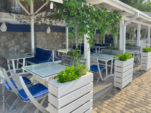 Outdoor seating area at restaurant near coast