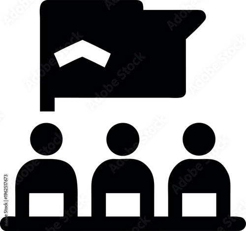 A group of people sitting at a table listening to a presentation being given by a speaker standing next to a large screen with a house graph on it in a business meeting room setting with a