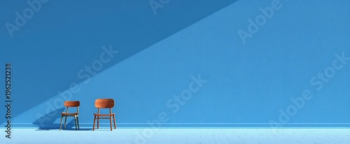 Minimalist blue wall interior with two wooden chairs and diagonal sunlight for design background poster and seating concept