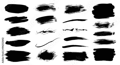 Collection of black ink brush strokes and splatters for artistic design elements