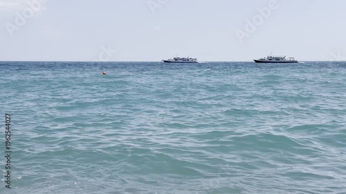 Boats on the water near the shore in daytime