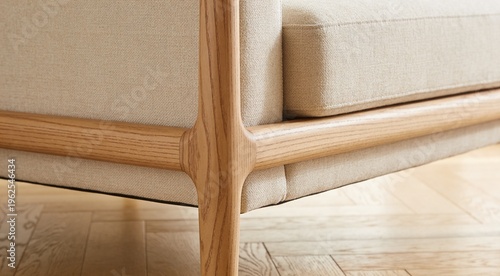 Intricate Macro Details: Polished Light Oak Hardwood Floor and Low-Profile Beige Linen Sofa with Wooden Frame, Shallow Depth of Field