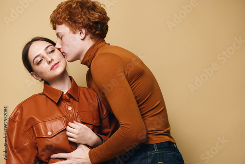 Foto Couple with man kissing woman on cheek for love and affection