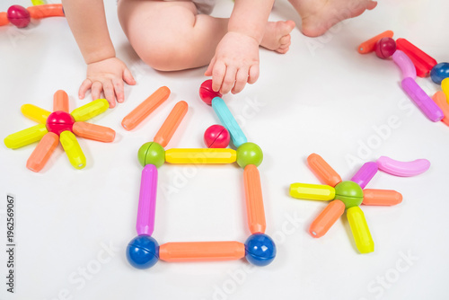 Baby Playing with Colorful Magnetic Building Toys