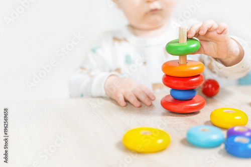 Fotografía Child Playing with Colorful Stacking Rings Toy