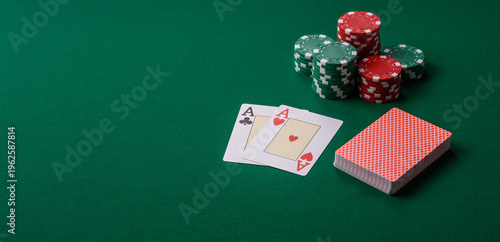 Playing cards and chips on a green cloth, a gambling game of blackjack or baccarat. Cards and chips