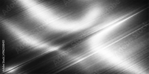 Striking metal texture featuring a dynamic interplay of light and shadow, perfect for a high-tech or industrial aesthetic. 