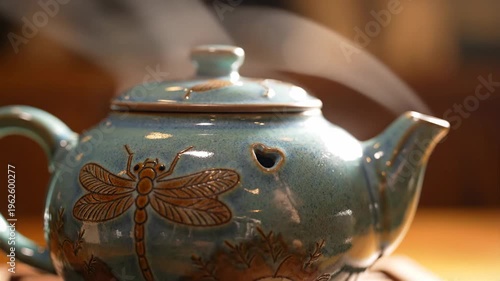 Steaming turquoise teapot with dragonfly motif, detailed ceramic, rustic kitchen ambiance, warm afternoon light, relaxation