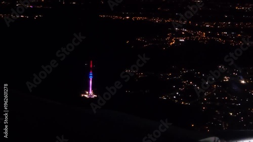 BELGRADE - SEP 18, 2025: Tall tower with a red, white and blue light on top. The tower is lit up at night