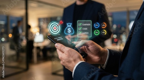 A person using their smartphone, with holographic financial symbols and the background shows a blurred office setting