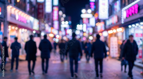 Blurred neon city crowd night street abstract urban people silhouettes colorful bokeh motion