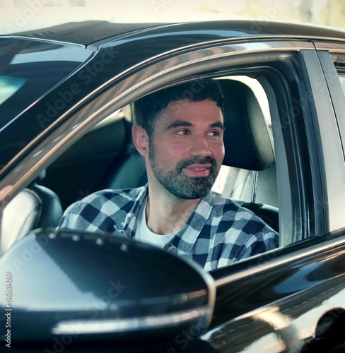 Dealer giving key to new owner in auto salon. Car sale, deal, people concept.