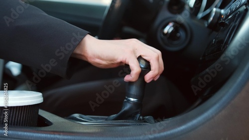 Lady in personal automobile driving, starting trip