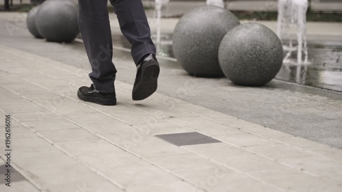 Man going along the street. Cropped. Slow motion