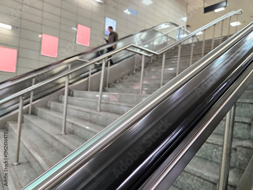 Wallpaper Mural Person is walking up a set of stairs with a black railing. The stairs are empty and the person is the only one on the stairs Torontodigital.ca