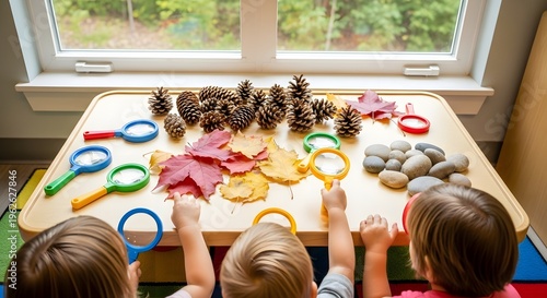 Children playing with magnifying glasses and toys by the window