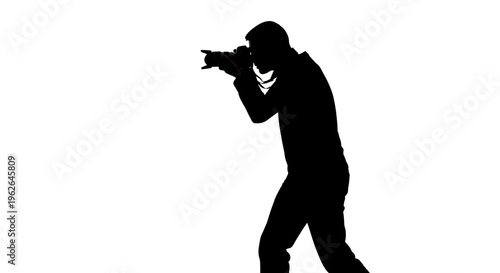 Silhouette of a man aiming a camera to the side