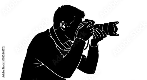 Man taking a photo with a large camera lens