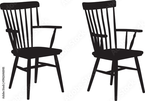 Two black wooden chairs with armrests and spindles 