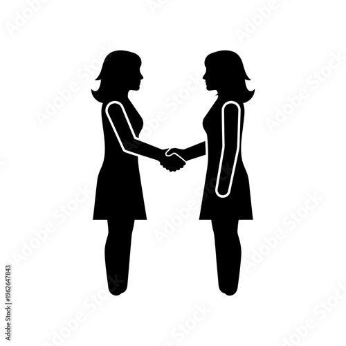 Two women shaking hands in agreement.