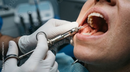 Dentist administering local anesthetic to patient's gum before tooth extraction.