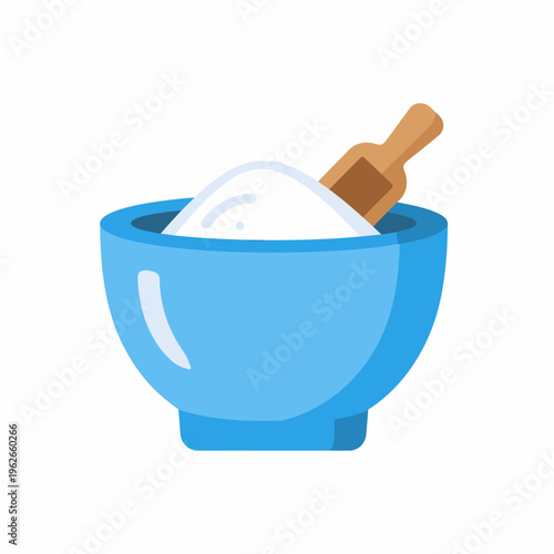 A close-up view of a bowl containing flour and a scoop