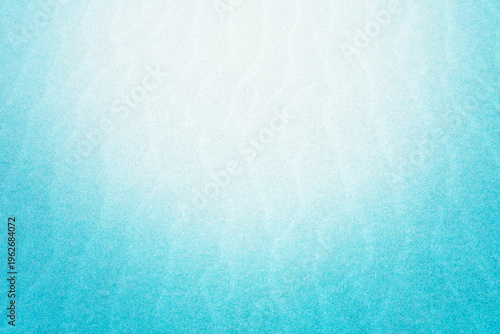 砂浜に浮き出た風紋と水色のグラデーション