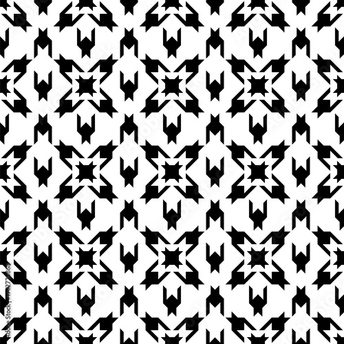 Modern abstract houndstooth seamless pattern in black and white with geometric symmetrical shapes. High contrast textile design ideal for fabric, fashion prints, wallpaper, packaging and graphic backg