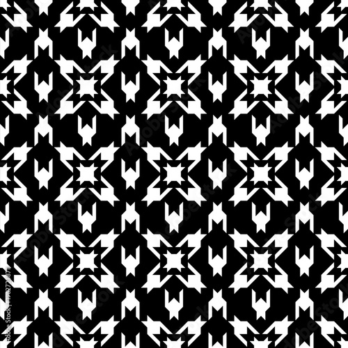 Modern abstract houndstooth seamless pattern in black and white with geometric symmetrical shapes. High contrast textile design ideal for fabric, fashion prints, wallpaper, packaging and graphic backg