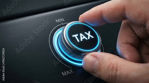 A human hand adjusts a glowing blue tax knob on a dark control panel to regulate financial policy