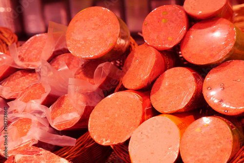 Obraz na płótnie Meat products on display in a market setting during the day