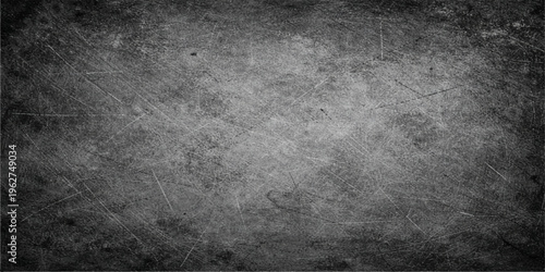 A dark aged metal backdrop featuring a rough gray concrete texture with a vintage grunge effect on a dirty black stone surface pattern