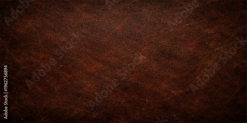 A vintage dark brown leather texture features an aged grunge pattern on a rough natural skin surface, perfect for an old fabric material backdrop or wallpaper design