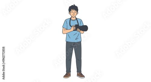 Young man holding a camera outdoors.