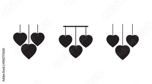 Black hearts hanging from strings in various groups on white background  heart shapes  love symbols